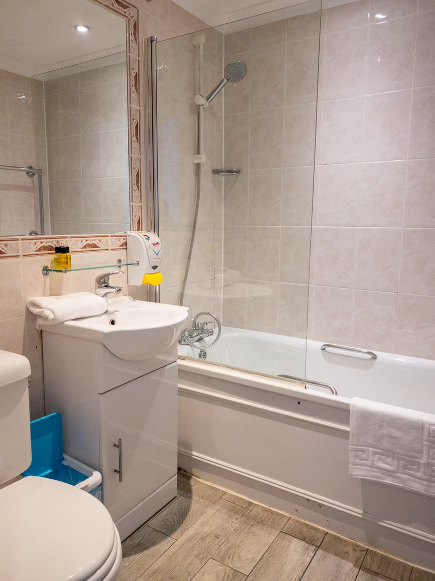Private en-suite bathroom with bathtub and shower