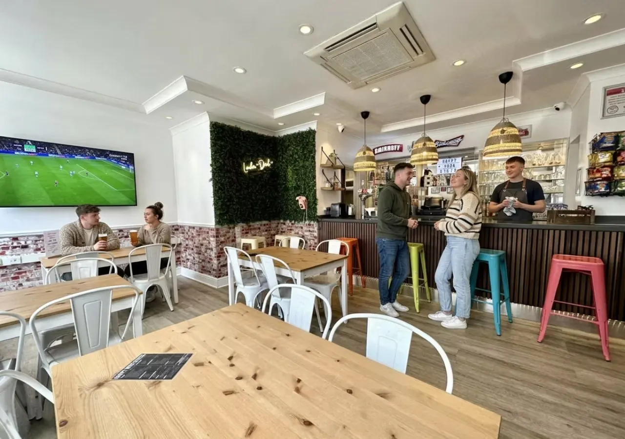On-site bar and cafe with football on the TV