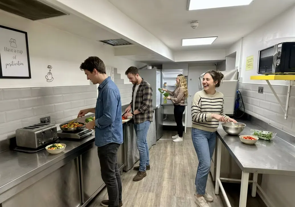 Guests cooking in the self-catering kitchen