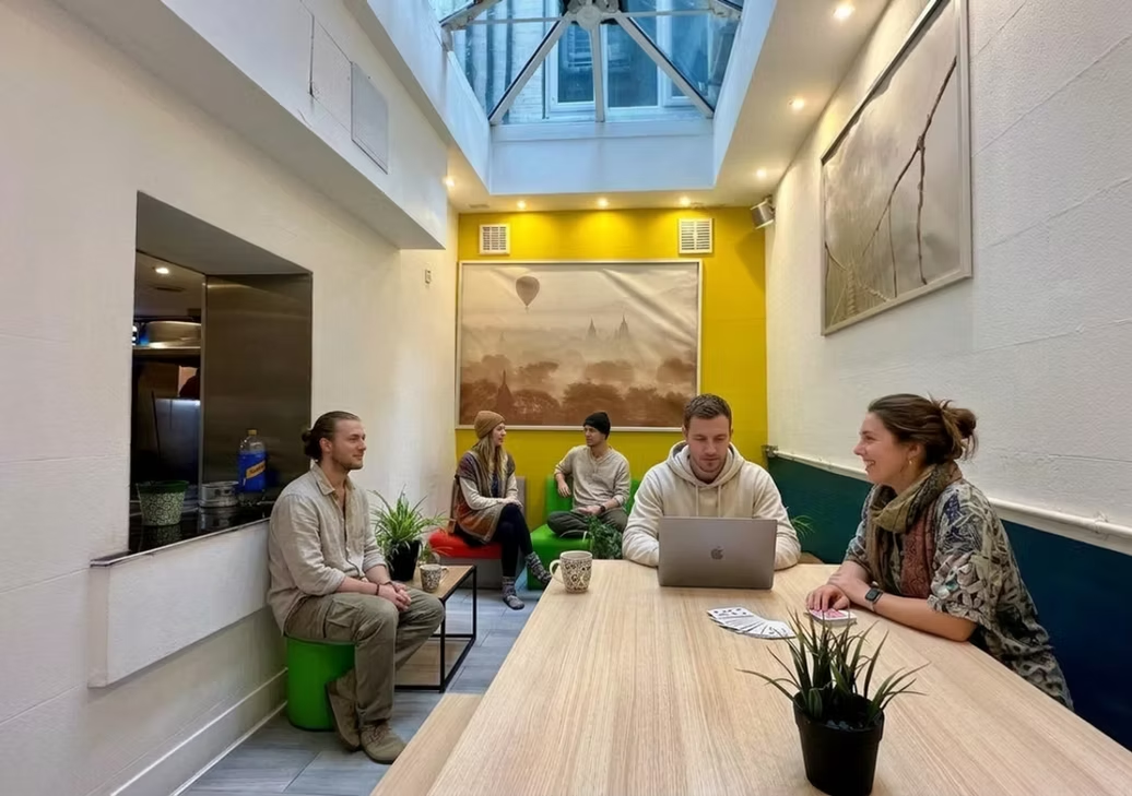 Skylit lounge with laptops and board games