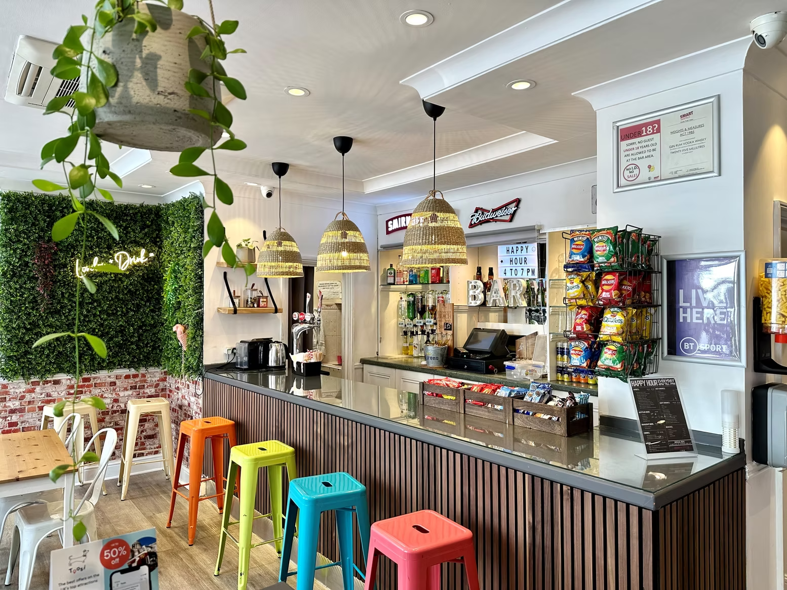 On-site bar with colourful stools and pendant lights