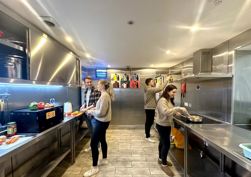 Guests cooking in the self-catering kitchen